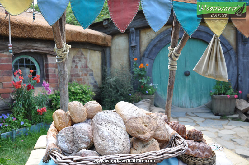 Hobbit bread props in front of a hobbit house - Hobbiton Movie Set New Zealand - Woodward Culture Travel Guide