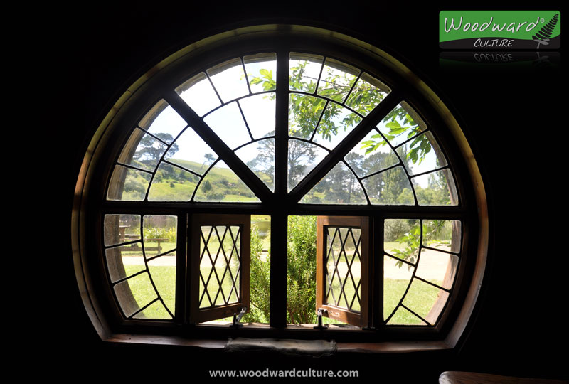 Looking out a round window at the Green Dragon Inn - Hobbiton Movie Set New Zealand - Woodward Culture Travel Guide