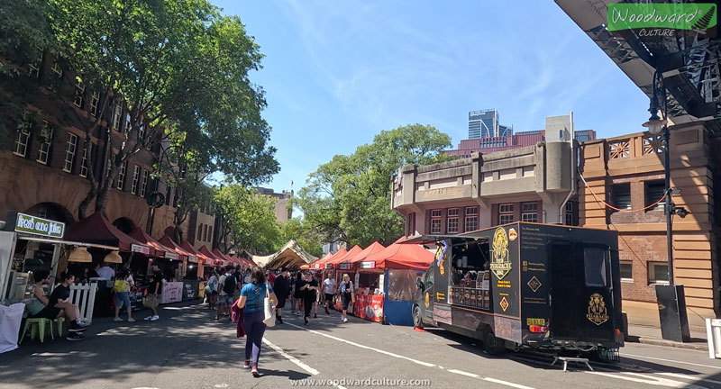 The Rocks markets entrance under the Sydney Harbour Bridge, Australia - Woodward Culture